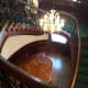 The grand staircase from the second floor. Shaped like a heart!