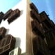 Building with wooden lattice window is common in Al-Balad