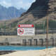 You can read the sign - don't go in this pool of water! It belongs to the power plant.