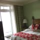 Bedroom 1 with a king bed, ensuite, and walk out to balcony overlooking Lake Rosseau.