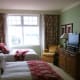 Bedroom 2 with two queen beds in a two bedroom suite at The Rousseau.