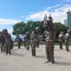 The "A-maze-ing Laughter" sculpture isn't right beside the path but is very close to it on Denman Street. English Bay Beach can be seen in the background of this photo.