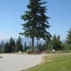 Burnaby Mountain Park with the Playground of the Gods sculpture and the North Shore Mountains in the background