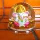 A Ganeesh snowglobe. Instead of snow, golden coins and golden glitter swirl around.....a good souvenir that is supposed to attract money.