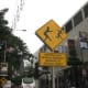 "Beware of Snatch Thief" sign. These are all around Kuala Lumpur and refer to motorbike thieves - hold onto your handbag!