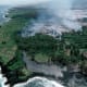 Aerial view of lava advancing down the slope toward Kalapana Village and Kaimu Bay.