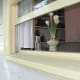 A vase of flowers in the kitchen