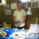 Margaret Holmes, the Club's field trip officer, with her collection of found rocks, shells and gems.