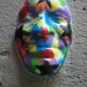 A mask decorating a side street (c) A. Harrison