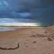The Sandy beaches of Beadnell Bay under an evening sky