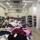 Inside the shop with carts of cheap clothes