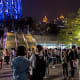 The surrounding ground level plaza at night.
