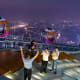 The Look Out, with evening-time Guangzhou skyline in the background.