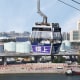 Sweeping views of Tung Chung and surrounding areas as Ngong Ping 360 cable cars cross over to the hills.