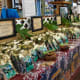 The farm outlet offers free samples of a variety of flavored macadamia nuts.
