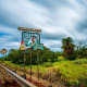 The sign on the highway pointing to the surfing town.