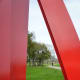 Biker viewed through "Houston" sculpture