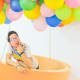 The author flying with the help of some balloons