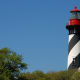 St. Augustine Lighthouse with its black and white spiral-striped tower.