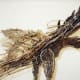 Art inside of the Art Car Museum. Silverware such as table knives were utilized in creating the wings of this bird sculpture.