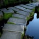 This forked pathway, parting as it does in the mid-point of a pond crossing, is yet another evil-spirit deterrent.