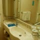 Sink & mirror area in bathroom of stateroom.