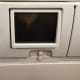A very dated, low definition, and very small media screen was on the back of each seat (non-touchscreen).