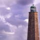 Old Cape Henry Lighthouse with 2 F-18s passing by in the distance from NAS Oceana.