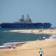 Aircraft Carrier entering Chesapeake Bay at First Landing State Park in Virginia Beach, Virginia.