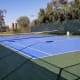 There are two tennis courts on the grounds, one of them doubles as a basketball court.