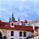 Prague Castle looms over Wallenstein Palace.
