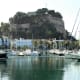 The craggy outcrop towers over Denia port.