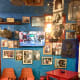A vibrant interior filled with bright colors and memories in frames.