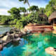 The swimming pool curved out of natural granite rocks