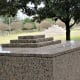 View of the granite monument at the top of the hill with the main monument below.