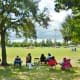 Parents watching kids playing soccer