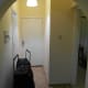 Front door, bedroom to the right, shower room left.