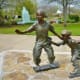 Sculptures of Kids Skateboarding and Rollerblading