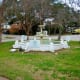 Antique dolphin fountain in need of repair