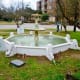 Antique dolphin fountain in need of repair