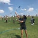 People flying kites on the hill near Miller Outdoor Theater