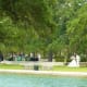 Bridal photos being taken near reflection pool in Hermann Park