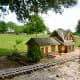 Miniature buildings along train tracks