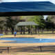 Shaded seating areas in Congressman Bill Archer Park