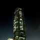Williams Tower lit up at night showing the word TEXANS