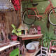 Outdoor area with vintage gardening supplies, plants and more