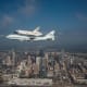 Space Shuttle Endeavour is ferried by NASA's Shuttle Carrier Aircraft (SCA) over Houston, Texas on September 19, 2012