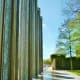 Mist sprayed sidewalk from waterfall columns