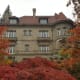 Exterior view of the mansion in the fall season