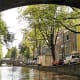 Amsterdam framed by a bridge.
